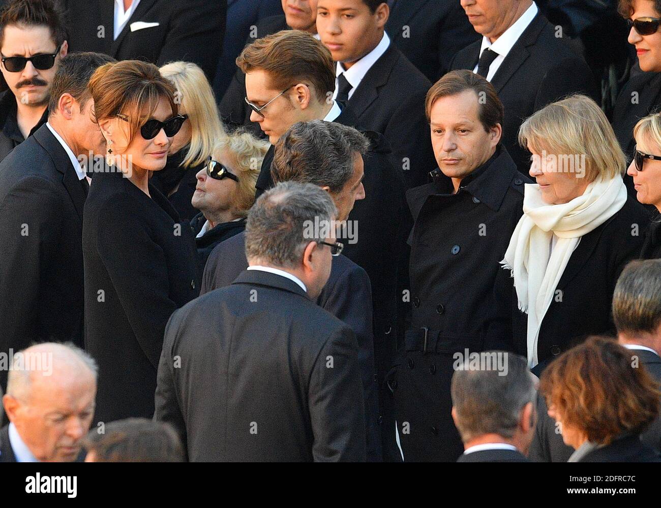 Nicolas Sarkozy and Carla Bruni with Charles Aznavour's daughter Katia, and his widow Ulla Thorsel during the national tribute ceremony to honour French-Armenian singer Charles Aznavour, one of France's most famous stars, who died aged 94, in the courtyard of the Hotel National des Invalides in Paris, France on October 5, 2018. Photo by Christian Liewig/ABACAPRESS.COM Stock Photo