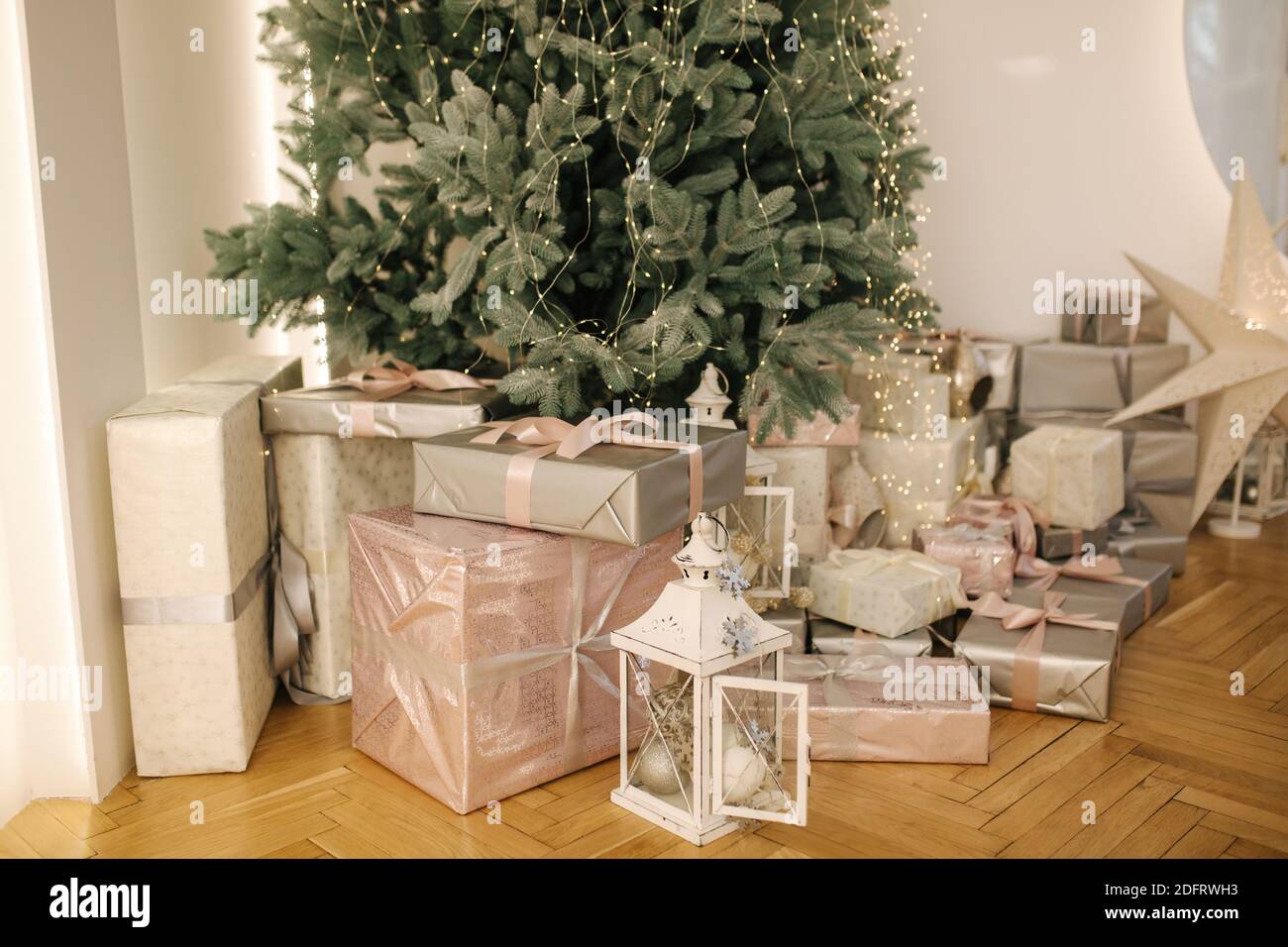 A lot of presents under Christmas tree. Beautiful packed different