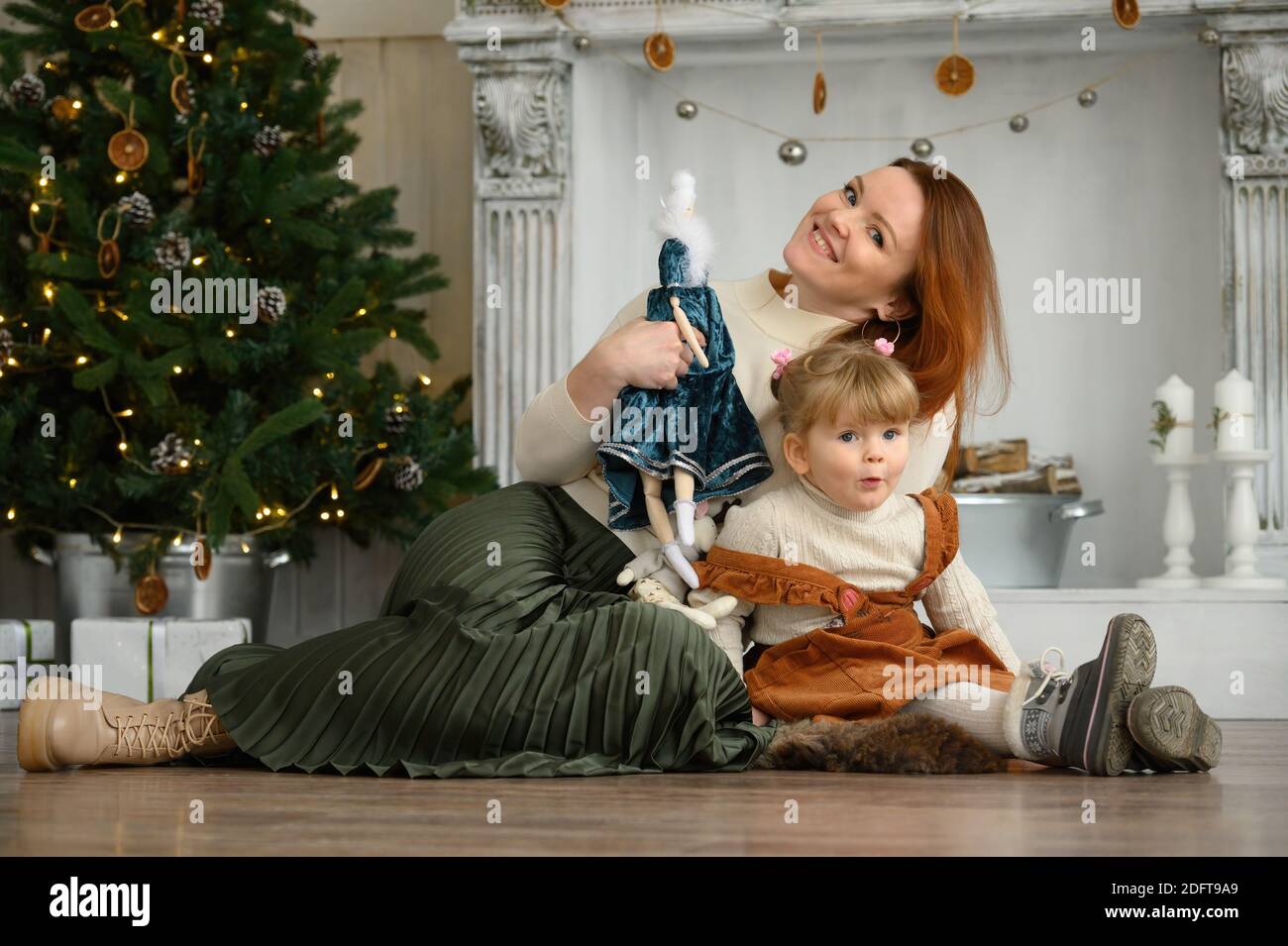 family portrait, happy mother and daughter at Christmas time Stock Photo