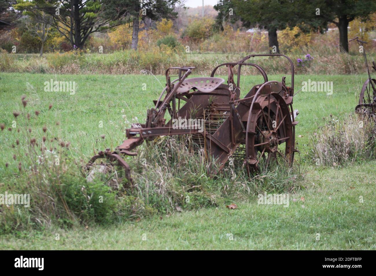 Yard art at the city park; antique farm equipment Stock Photo Alamy