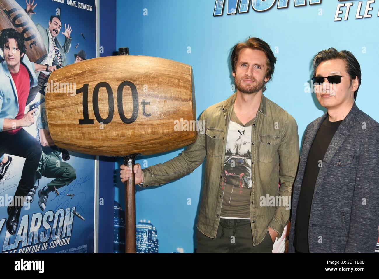 Actor Philippe Lacheau and Nicky Larson's author Tsukasa Hojo attend the  photocall of 'Nicky Larson et le parfum de Cupidon' during the Comic Con  Paris 2018 held at La Grande Halle de