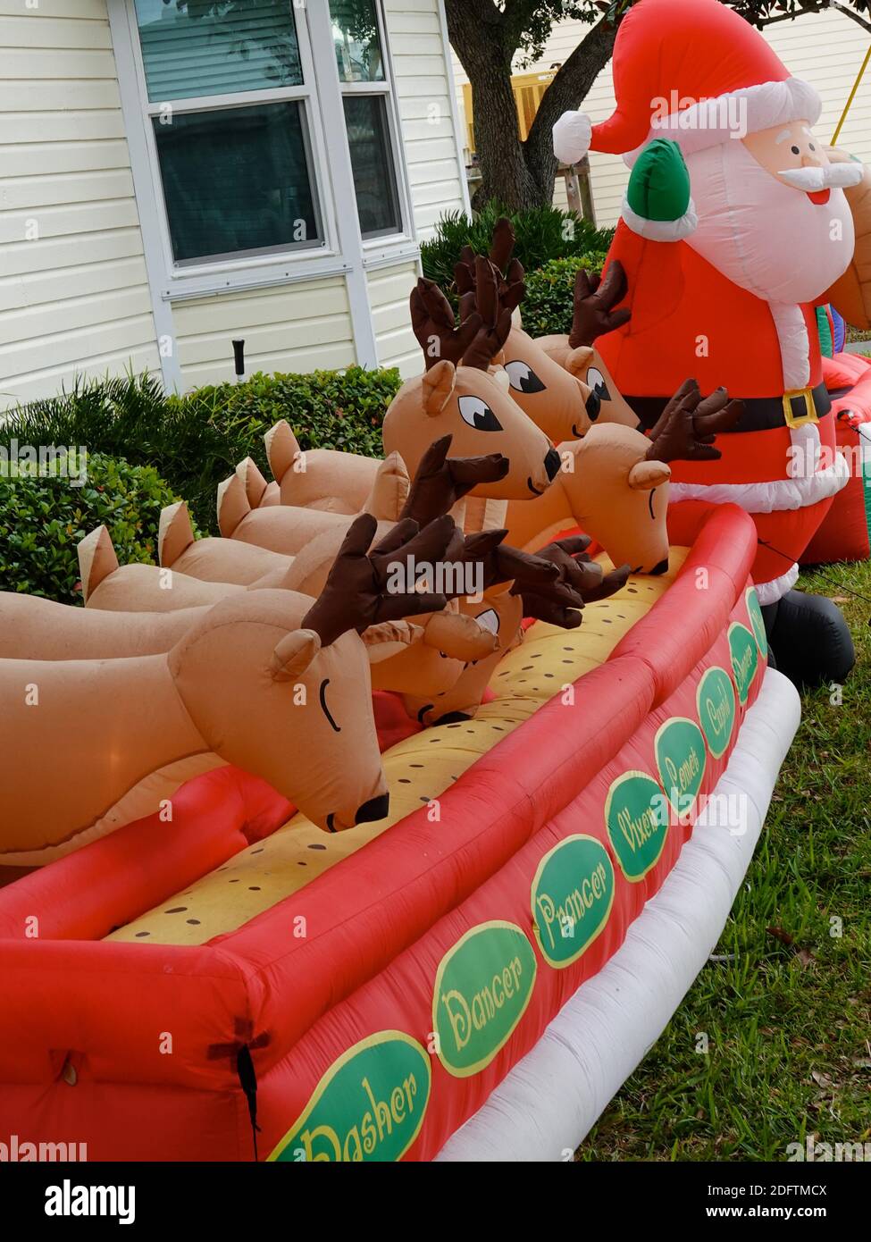 Plastic, inflated Santa Claus and his reindeer, decoration in downtown
