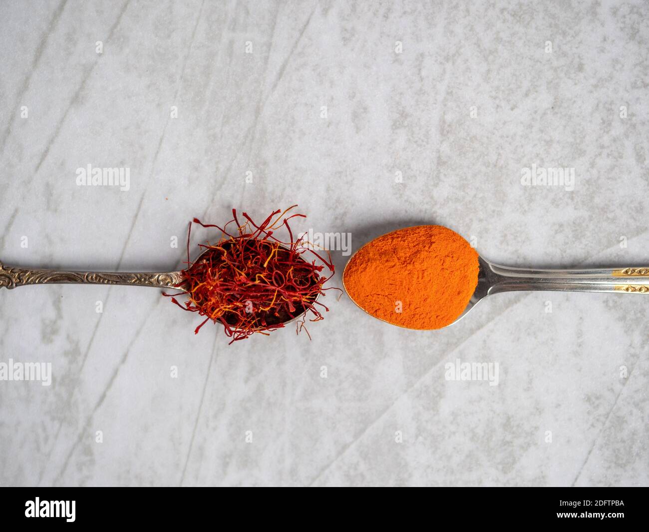 Saffron spice powder on spoons. Place for text. view from above. Food