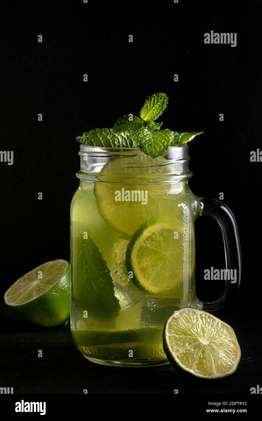 Lemon Base Lemon-based beverage in glass cup with handle, transparent, with ice ...