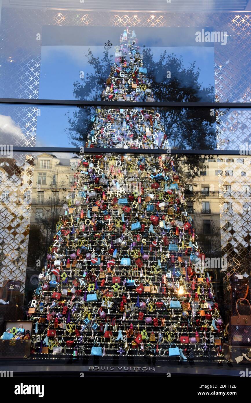A Christmas tree made of Louis Vuitton items is on display in the window of  the luxury brand flagship store for the holiday season on the Champs  Elysees in Paris, France, November