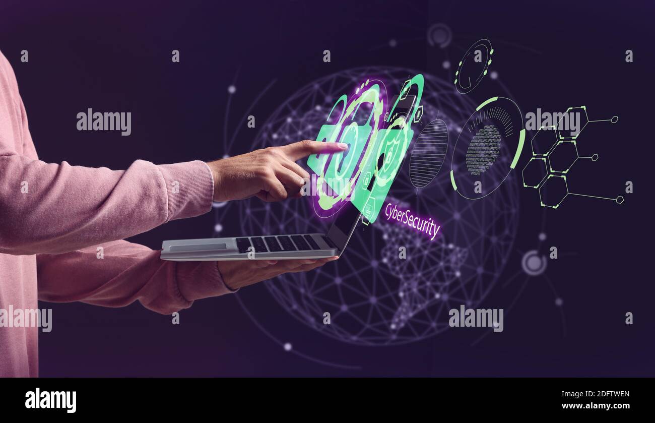 Man with laptop using software for data protection on dark background Stock Photo