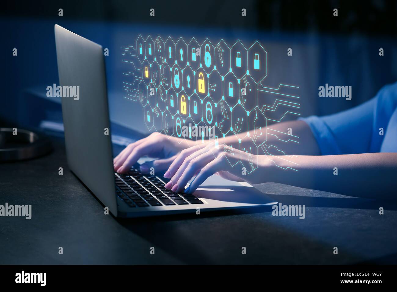 Woman with laptop using software for data protection on dark background Stock Photo