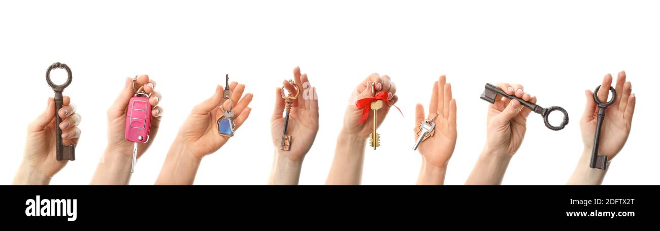 Female hands with different keys on white background Stock Photo - Alamy