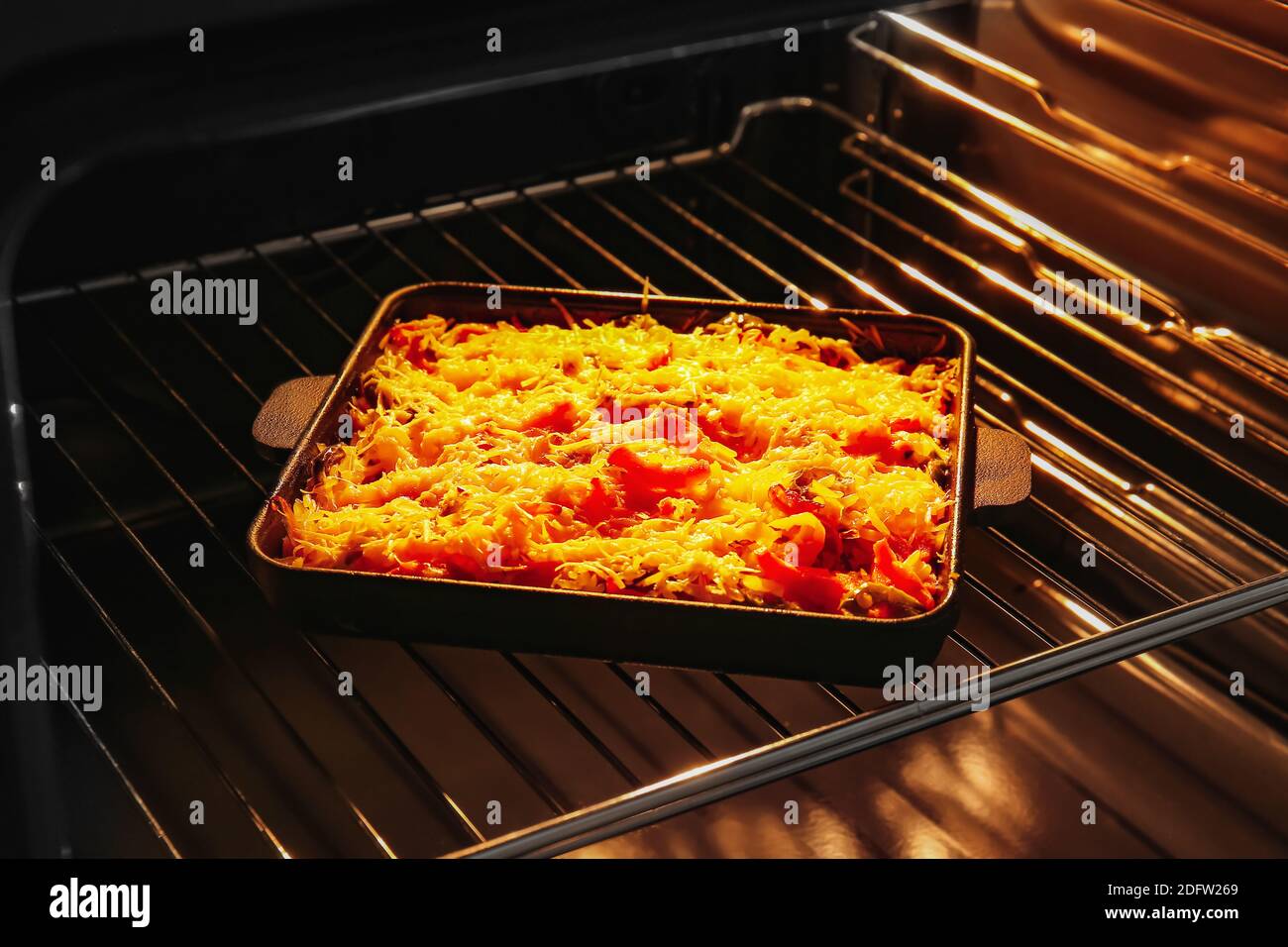 Cooking of rice casserole in oven Stock Photo Alamy