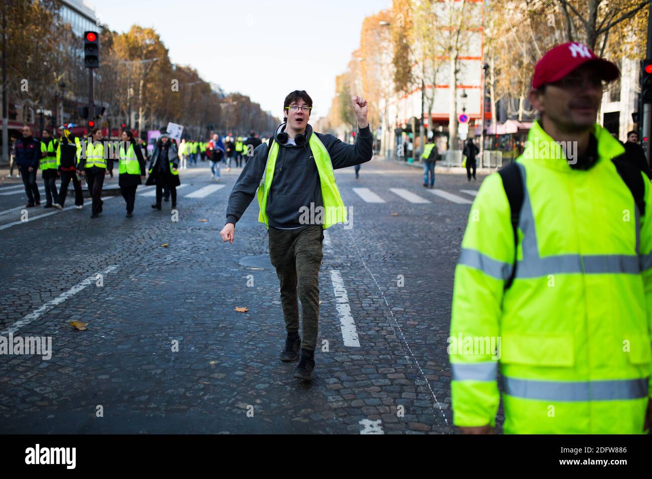 People block the traffic of Paris' landmark Avenue des Champs Elysees on  November 17, 2018 in Paris, during a nationwide popular initiated day of  protest called "yellow vest" (Gilets Jaunes in French)movement