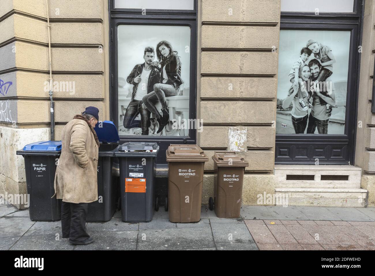 Poor man looking for the plastic bottles in the garbage can Stock Photo ...