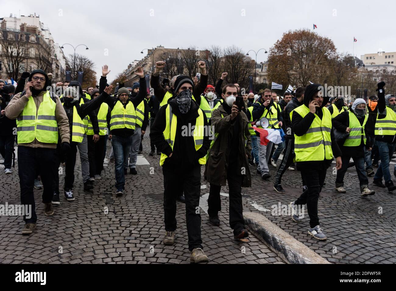Yellow vests (Gilets Jaunes) protestors clash with riot police during a  protest against rising oil prices on the Champs Elysees in Paris, France on  November 24, 2018. Security forces in Paris fired