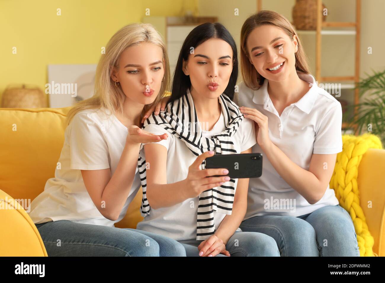 Beautiful young women taking selfie at home Stock Photo - Alamy