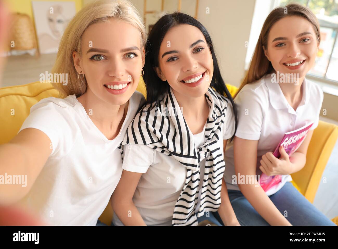 Beautiful young women taking selfie at home Stock Photo - Alamy