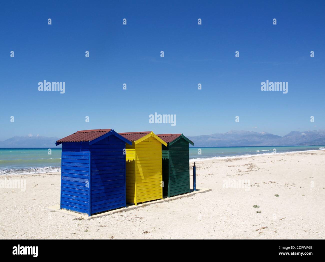 Brightly painted beach huts at Almyros Beach,Corfu, Greece Stock Photo