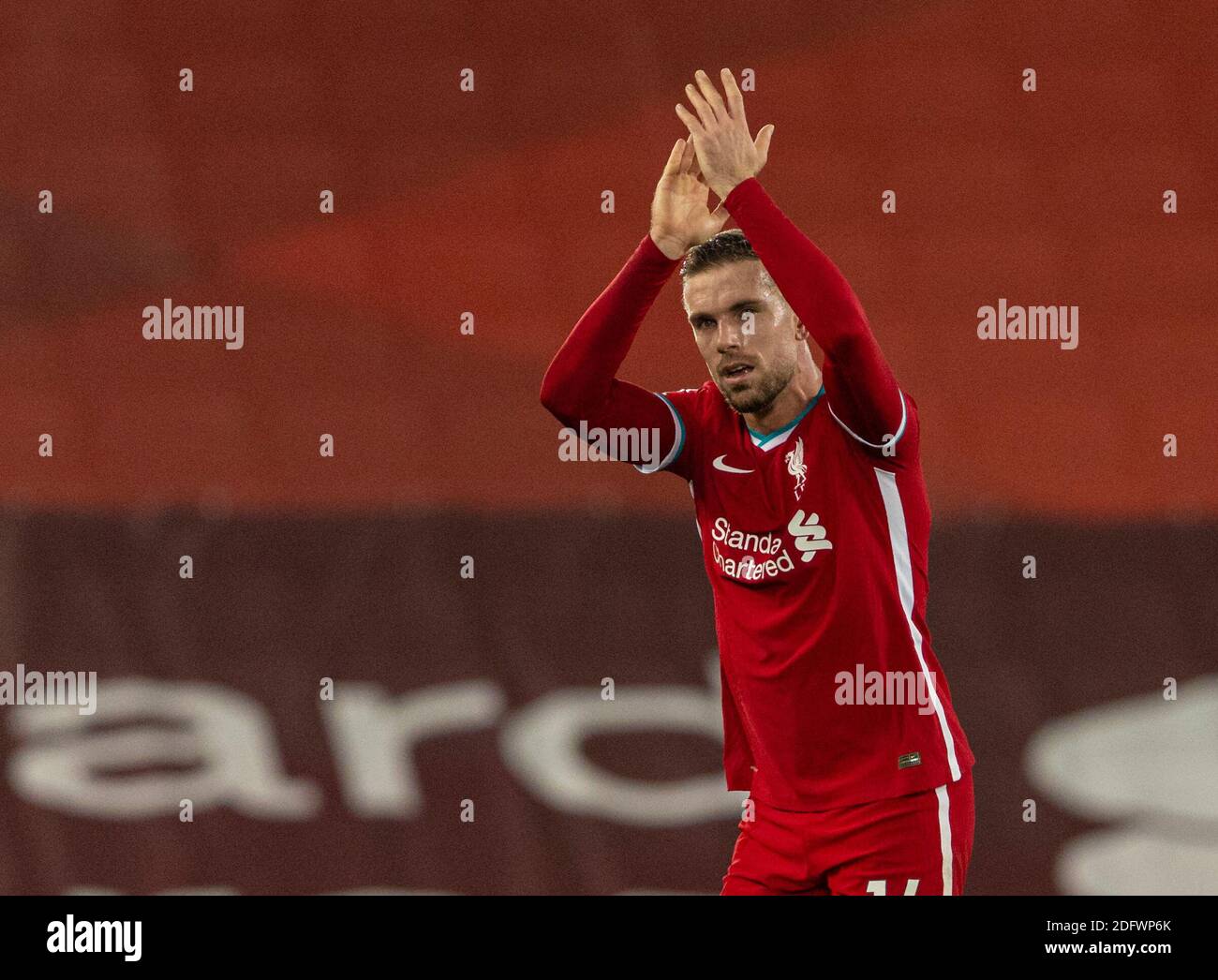 Liverpool. 7th Dec, 2020. Liverpool's Jordan Henderson applauds the supporters as he is substituted during the English Premier League match between Liverpool FC and Wolverhampton Wanderers FC in Liverpool, Britain, on Dec. 6, 2020. Credit: Xinhua/Alamy Live News Stock Photo