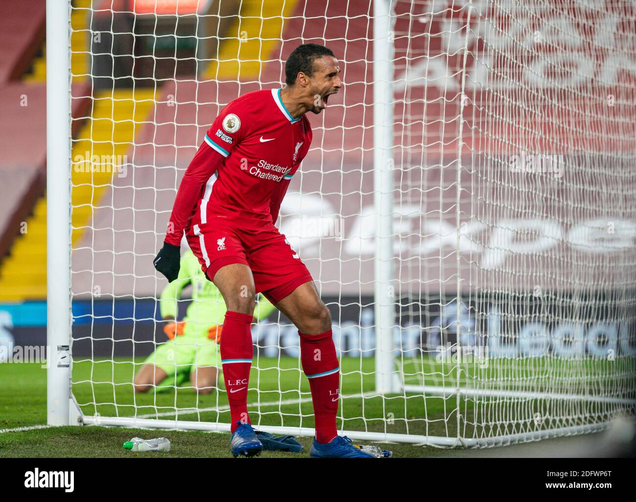 Liverpool. 7th Dec, 2020. Liverpool's Joel Matip celebrates after scoring the third goal during the English Premier League match between Liverpool FC and Wolverhampton Wanderers FC in Liverpool, Britain, on Dec. 6, 2020. Credit: Xinhua/Alamy Live News Stock Photo
