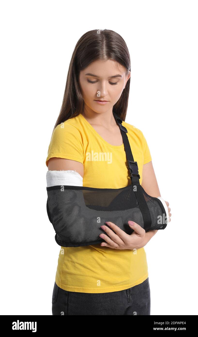 Young woman with broken arm on white background Stock Photo Alamy