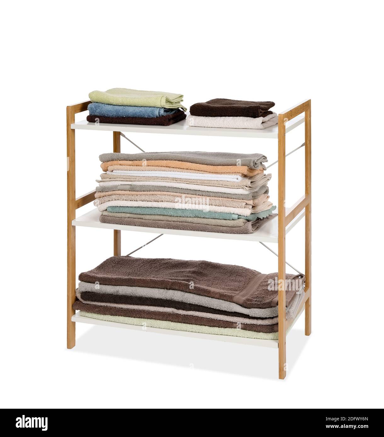 Modern shelf unit with towels on white background Stock Photo Alamy