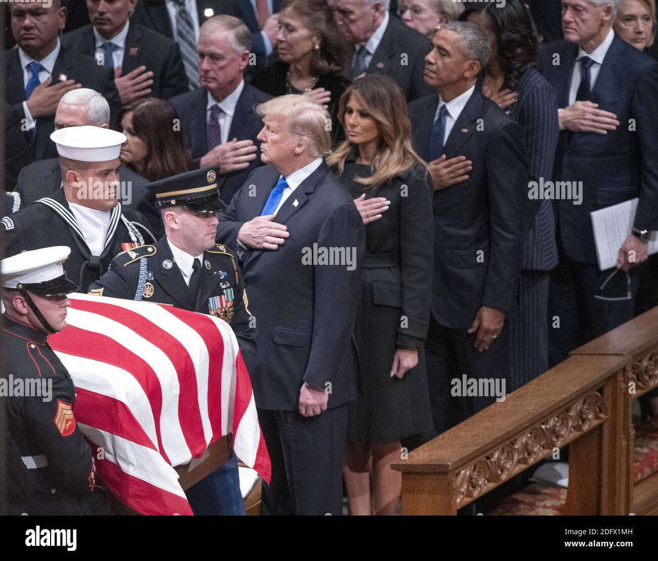 Dignitaries pay their respects as the casket containing the remains of the late former United States President George H.W. Bush at the National funeral service in his honor at the Washington National Cathedral in Washington, DC on Wednesday, December 5, 2018. Front row: United States President Donald J. Trump, first lady Melania Trump, former US President Barack Obama, and former US President Bill Clinton. Second row: former US Vice President Dan Quayle and Marilyn Quayle. Photo by Ron Sachs / CNP/ABACAPRESS.COM Stock Photo
