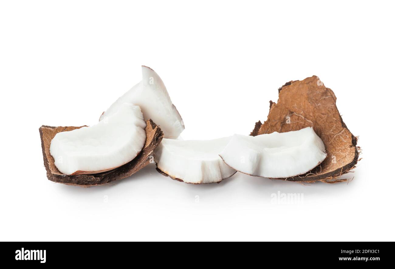 Pieces of ripe coconut on white background Stock Photo - Alamy