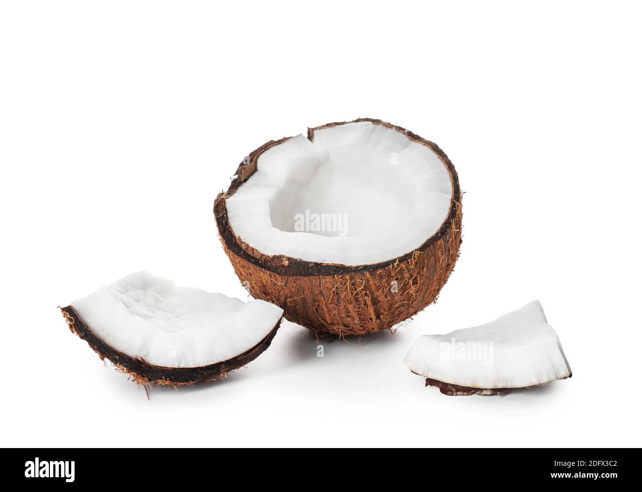 Pieces of ripe coconut on white background Stock Photo - Alamy