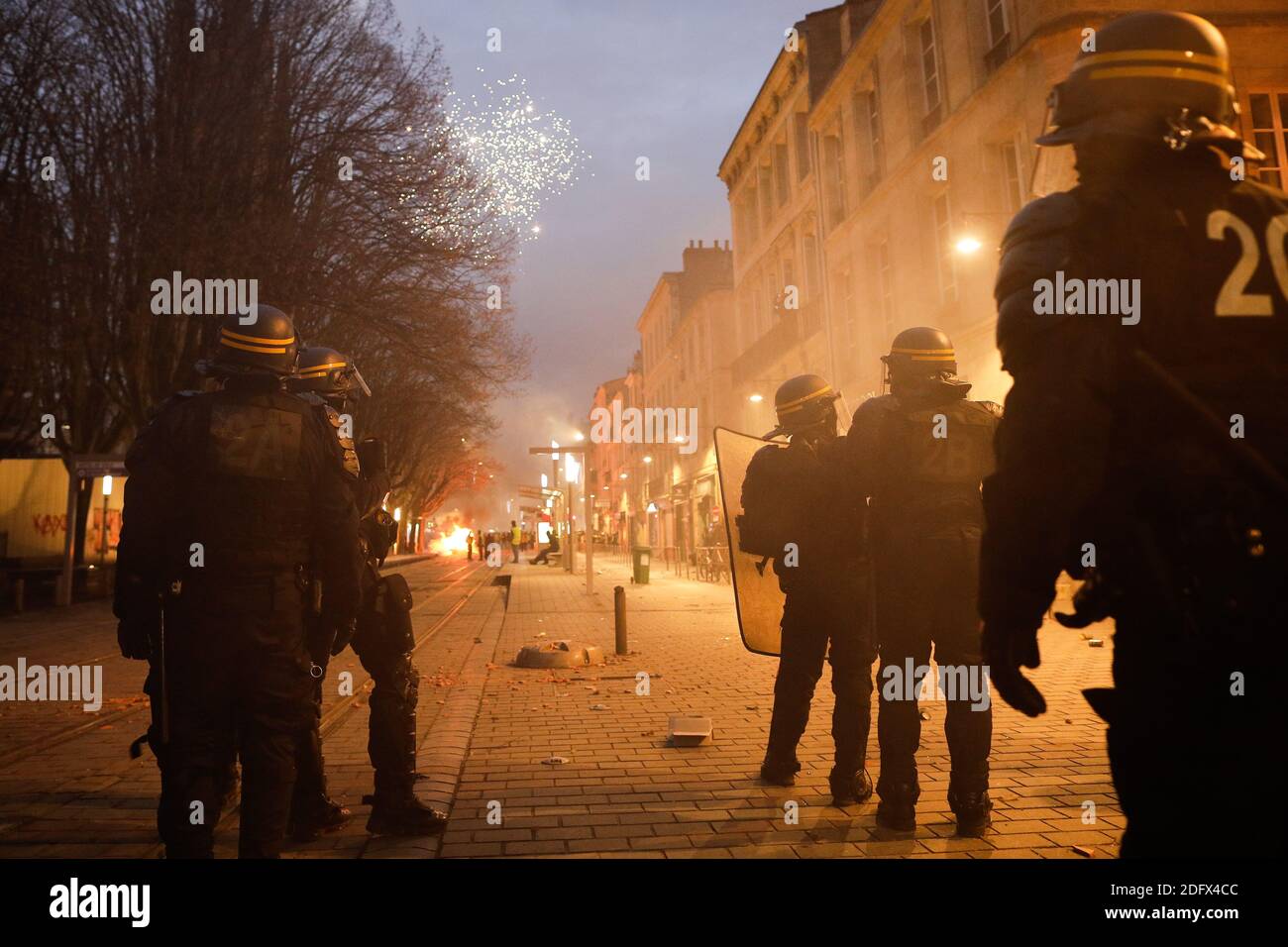 The demonstration of the Yellow Vests (Gilets Jaunes) ends with violent clashes between police and protesters. Fires, looting and degrading took place in several streets of the western France city of Bordeaux on December 08, 2018. Prime Minister Edouard Philippe has vowed to 'restore national unity' after violence broke out during a fourth consecutive weekend of protests. Police used tear gas and rubber bullets on Saturday - the latest day of 'yellow vest' demonstrations against fuel tax rises and high living costs. Almost 1,000 people were taken into custody but the violence was not on the sa Stock Photo