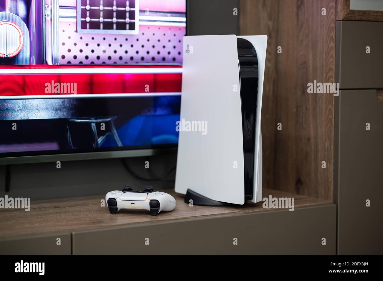 The brand new Sony PlayStation 5 gaming console with DualSense controller  near tv screen at home ready to use. Moscow - November 28 2020 Stock Photo  - Alamy