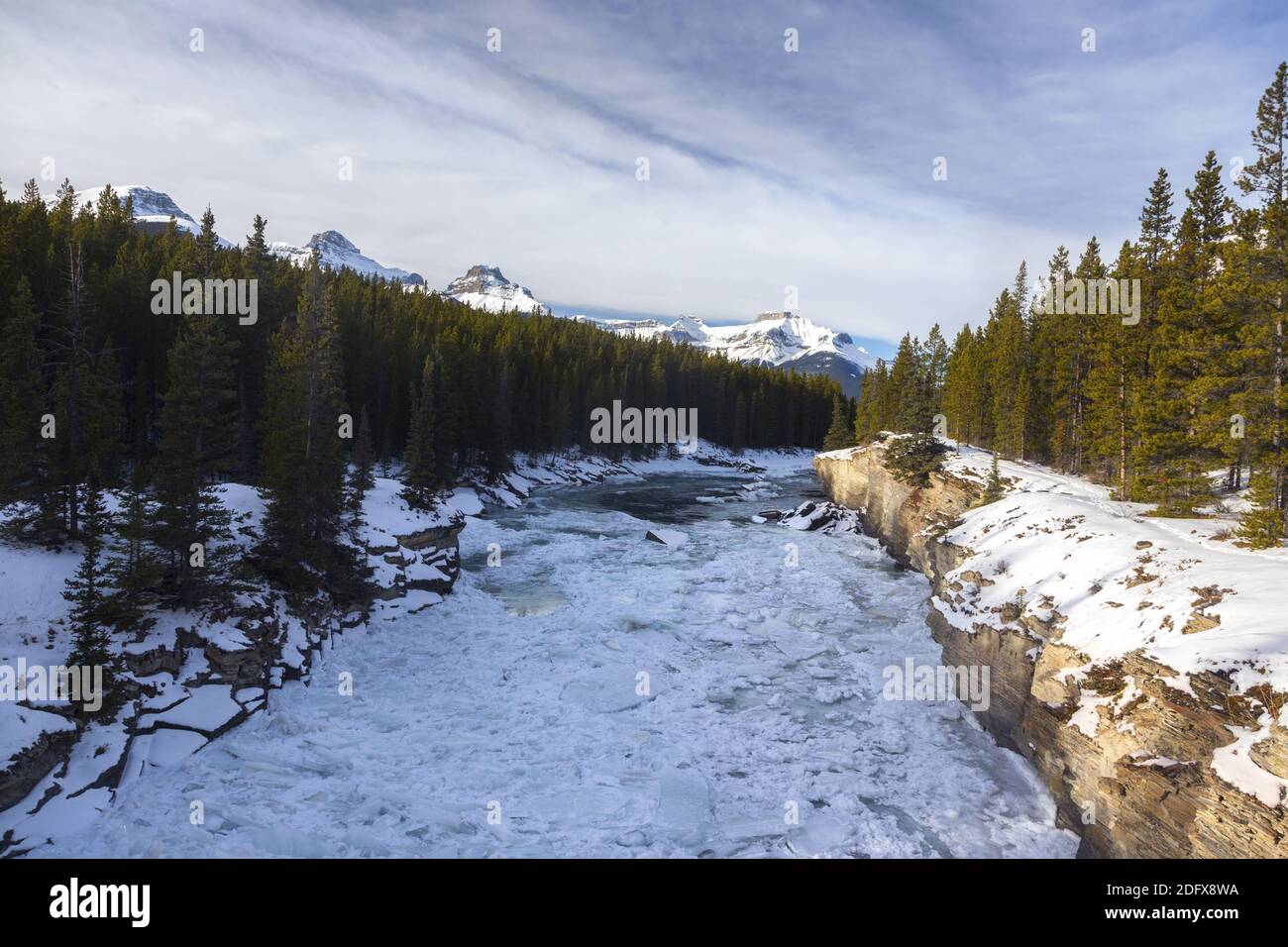 Frozen Ice Floating on North Saskatchewan River on Glacier Lake Hiking Trail in Canadian Rocky Mountains Stock Photo