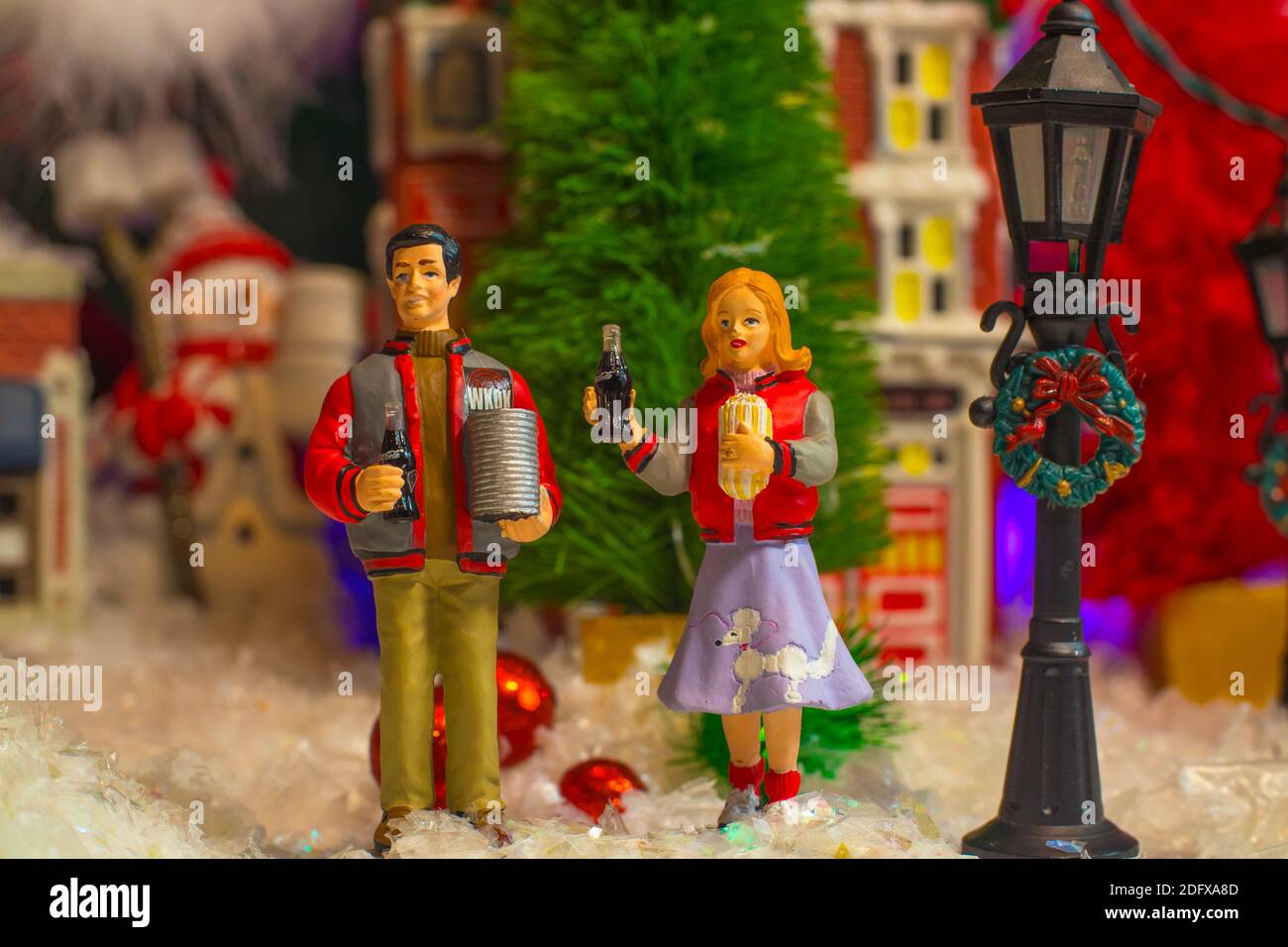 Augusta, Ga USA - 12 05 20: Coca Cola Holiday Vintage Village collection scene Town Square man and woman holding a coke Stock Photo