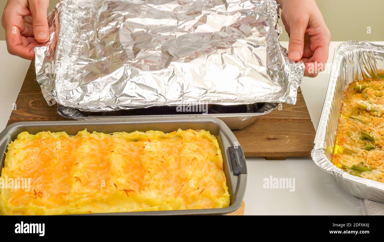 https://c8.alamy.com/comp/2DFXK6J/chef-taking-off-aluminum-foil-spicy-marinated-turkey-legs-cooked-in-a-disposable-bake-ware-pan-just-from-the-oven-close-up-view-from-above-step-by-2DFXK6J.jpg