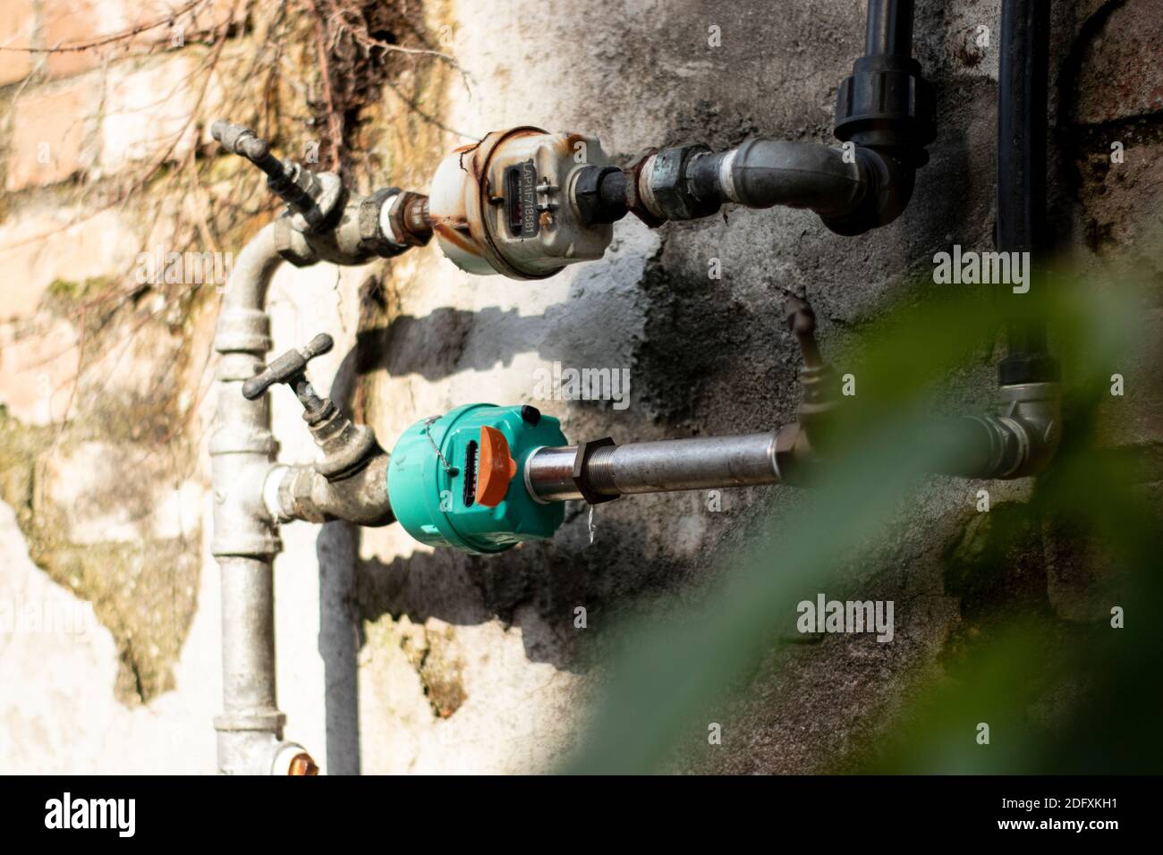 Old meter of the water, metal pipes and tab Stock Photo