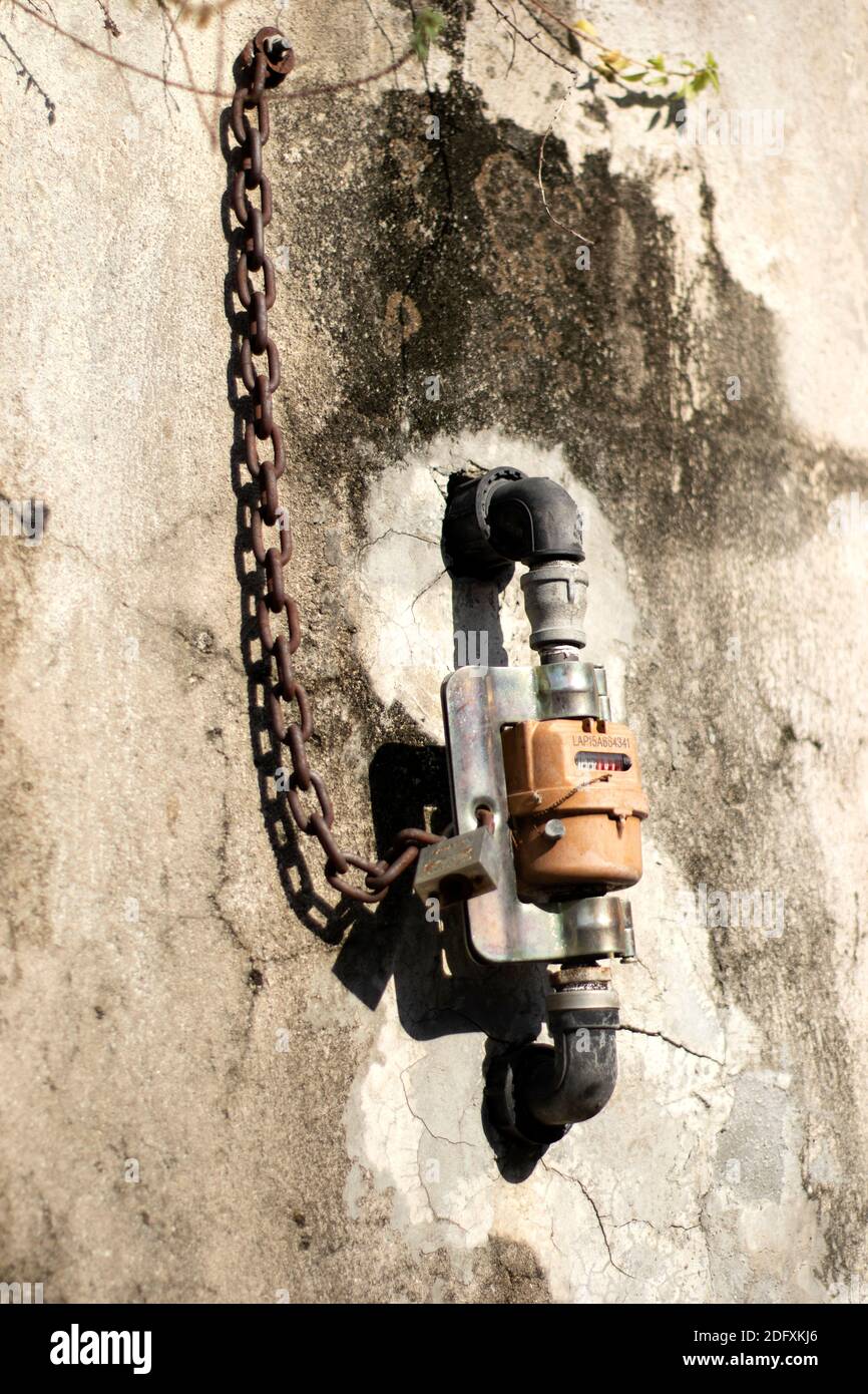 Old meter of the water, metal pipes and tab Stock Photo