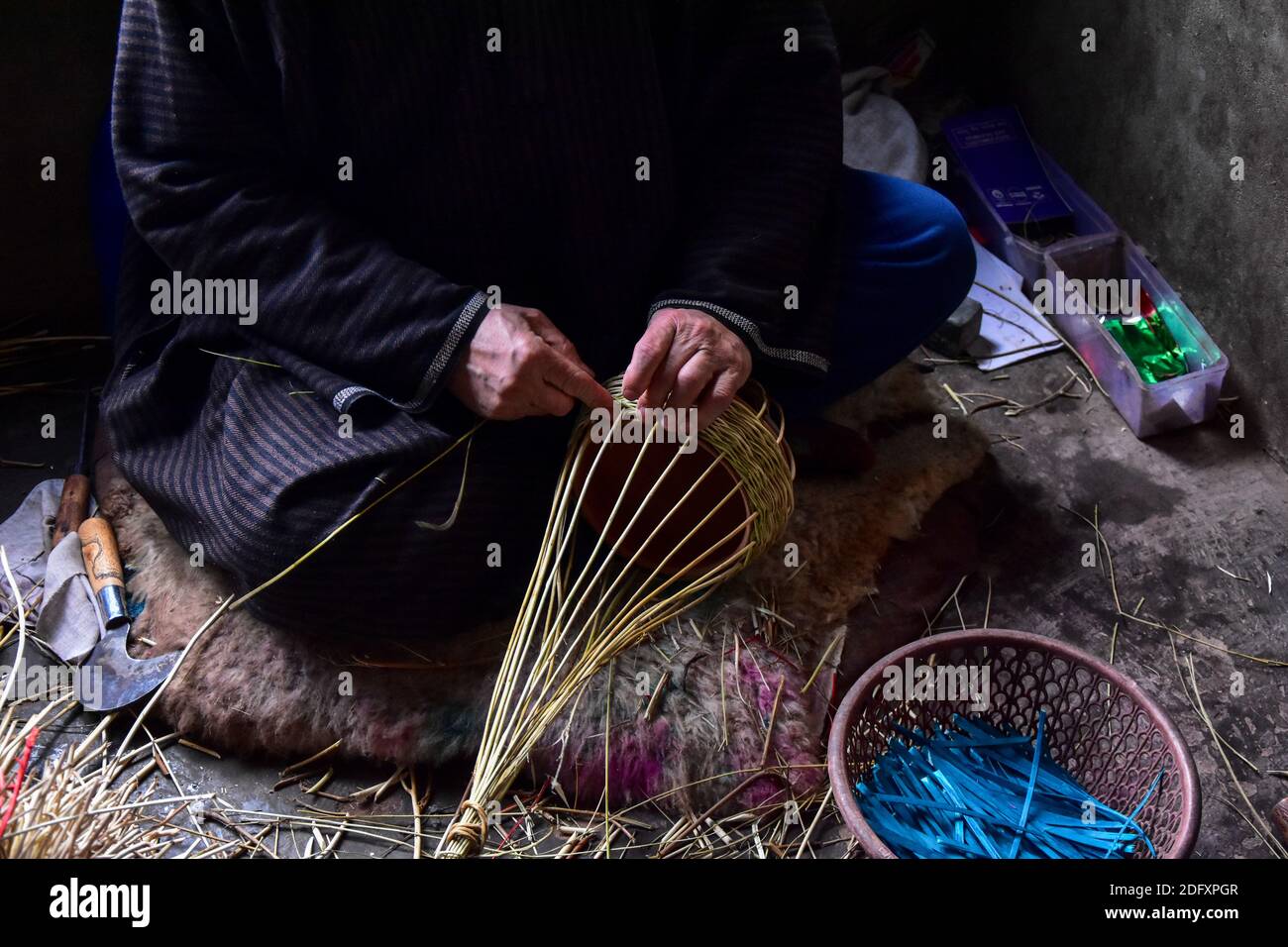 Budgam, India. 06th Dec, 2020. A Kashmiri artisan makes a 'Kangri', a traditional fire pot at his workshop in Budgam, about 35kms from Srinagar the summer capital of Jammu and Kashmir. Credit: SOPA Images Limited/Alamy Live News Stock Photo