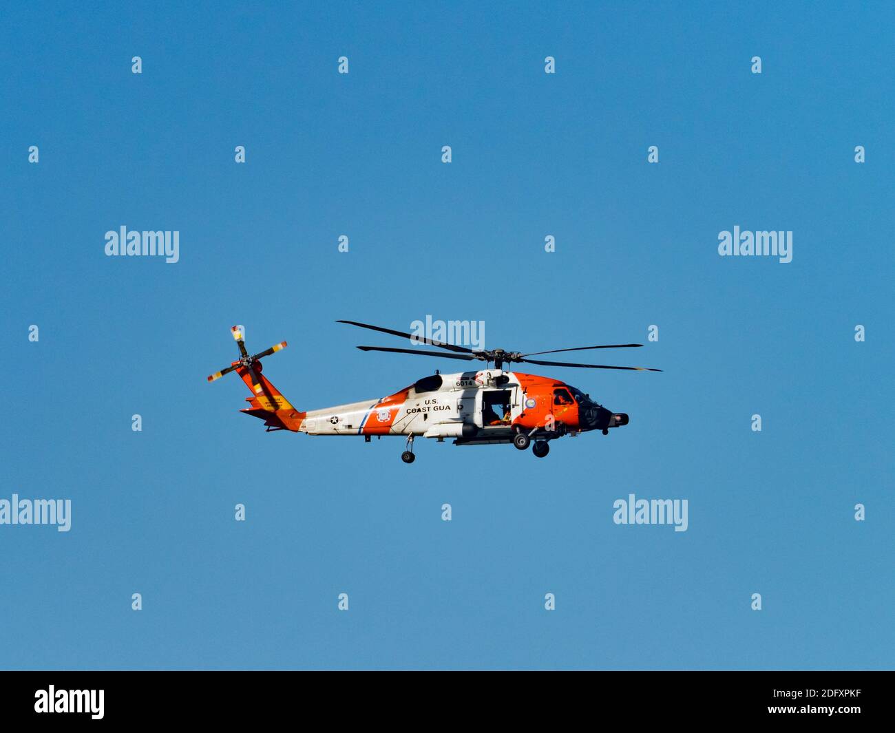 US Coast Guard helicopter 6014 Sikorsky patrolling over La Jolla Shores, San Diego, California, USA Stock Photo