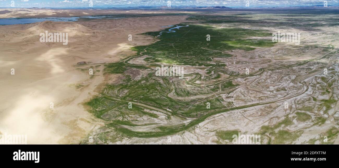 Aerial panorama sand desert Mongol Els and Zavkhan river Stock Photo