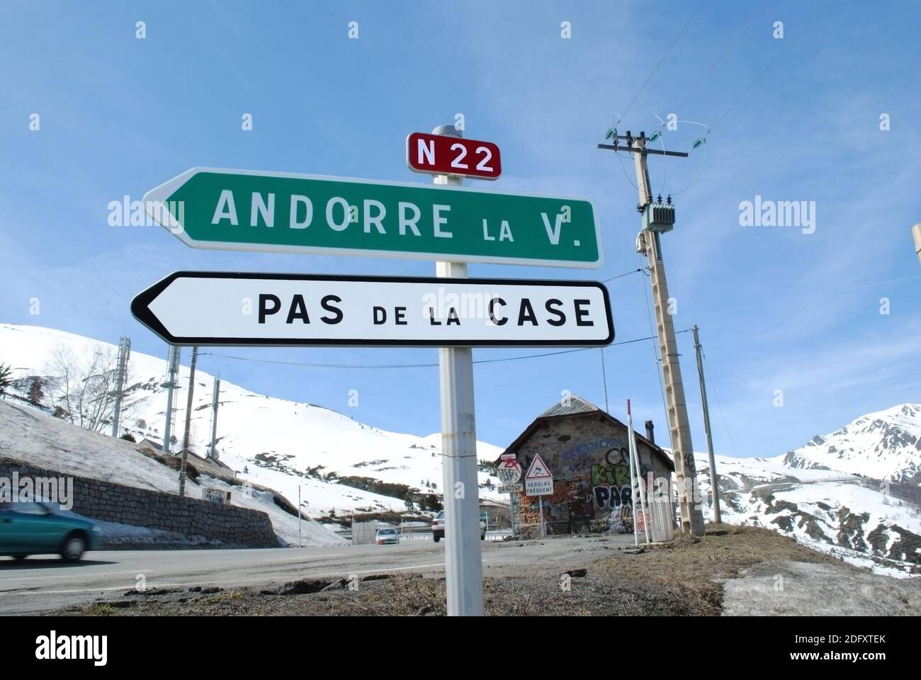 Traffic signs pointing towards the Franco-Andorran frontier in the French Pyrenees. Stock Photo