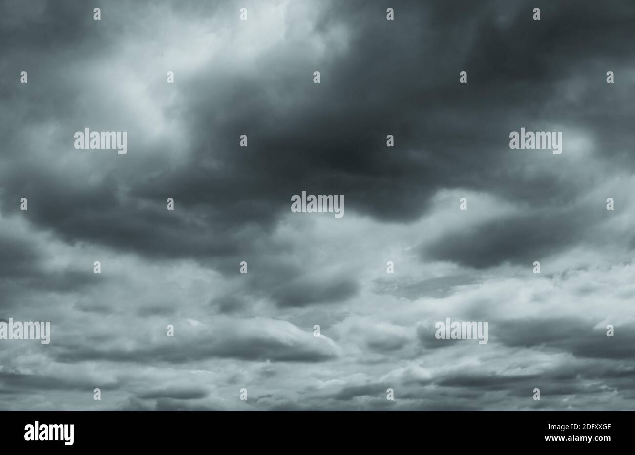 Gray and white fluffy clouds. Cloudy sky. White and gray texture background for sad, death, hopeless, and despair concept. Moody sky. Cloudscape. Dark Stock Photo