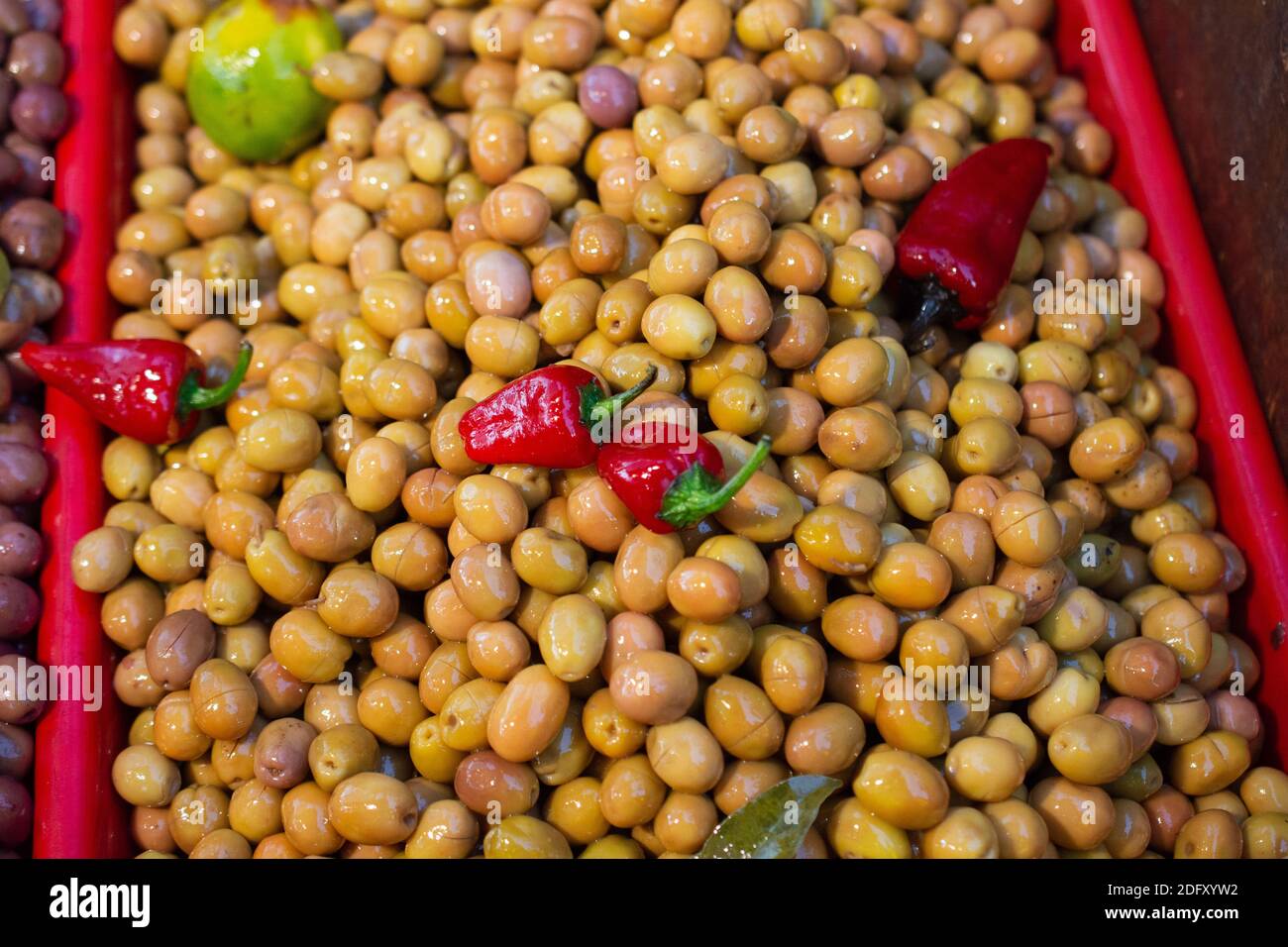 Green olives as health food preserved in olive oil Stock Photo Alamy