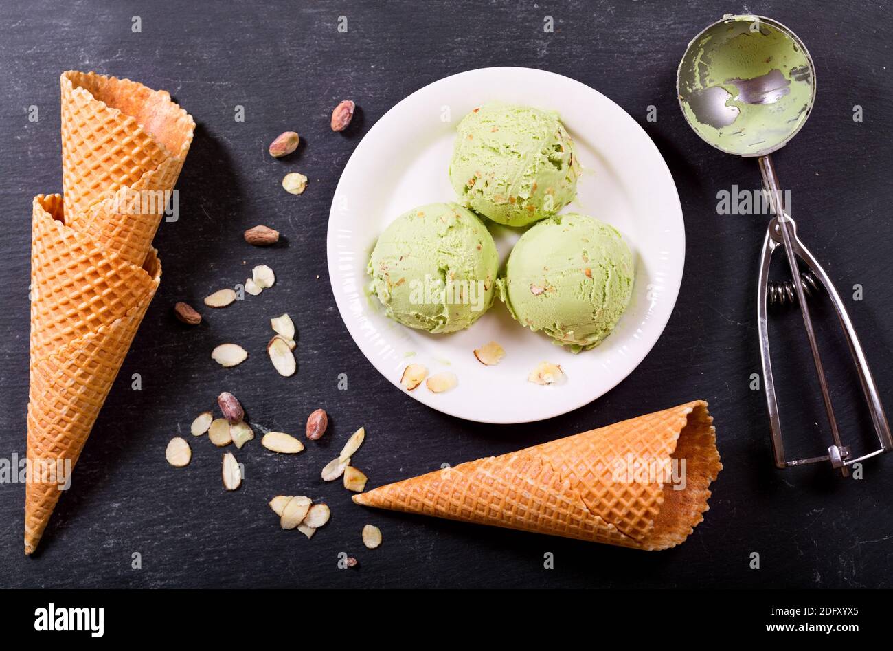 pistachio ice cream scoops on dark background, top view Stock Photo - Alamy