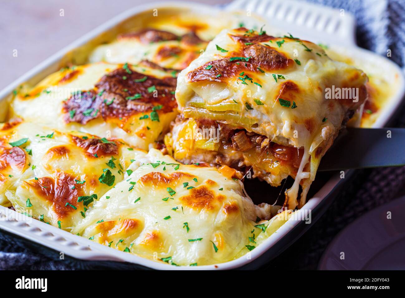Traditional Greek potato and meat casserole with cheese moussaka
