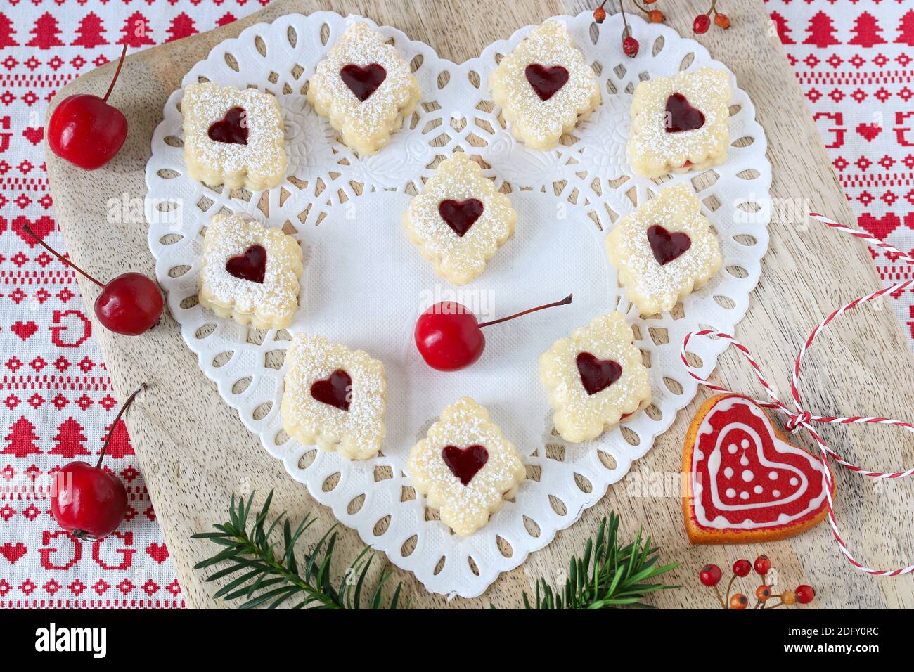 christmas biscuits Spitzbuben on wooden board Stock Photo