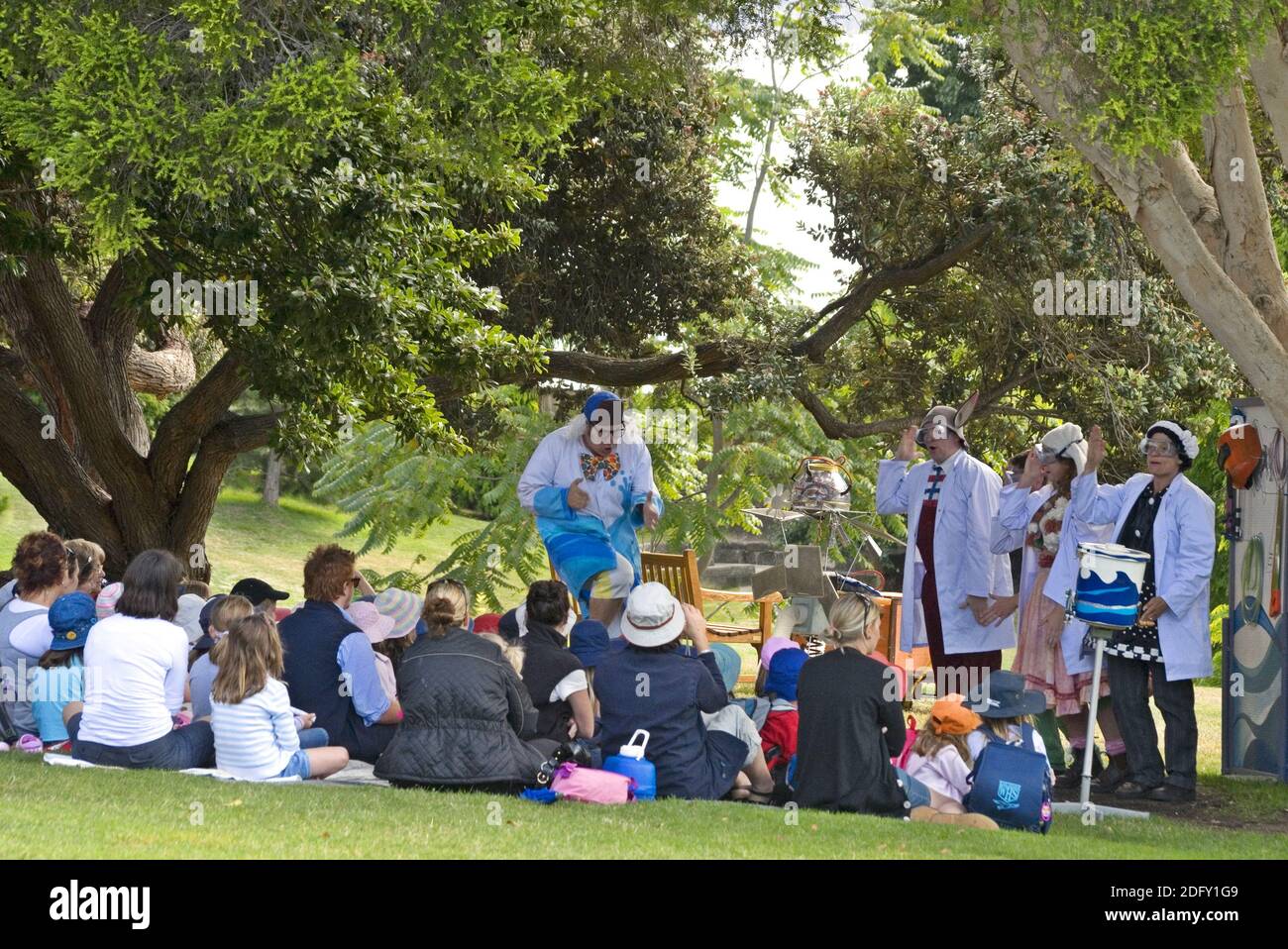 Australian children watch an open air theatrical performance at the botanical gardens in Hobart, Tasmania Stock Photo