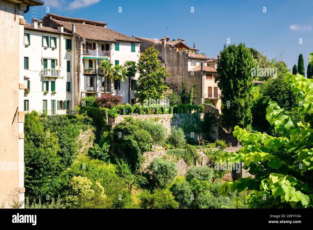 Detail of the ancient village of Asolo that climbs the hill dense with lush vegetation in summer, Treviso, Italy Stock Photo