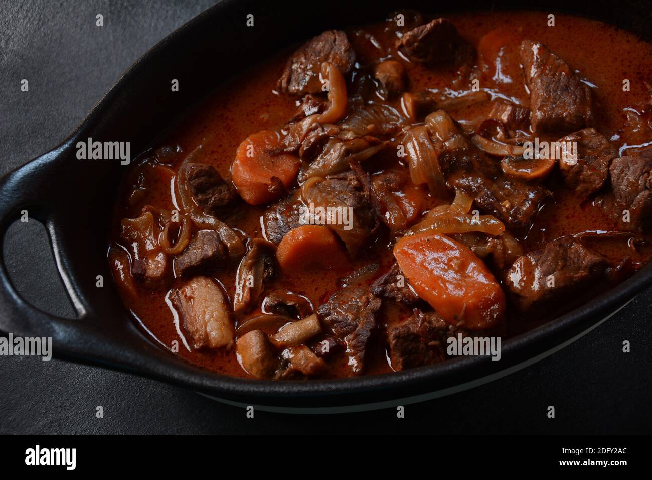Beef Bourguignon in a pan. Stew with red wine ,carrots, onions, garlic