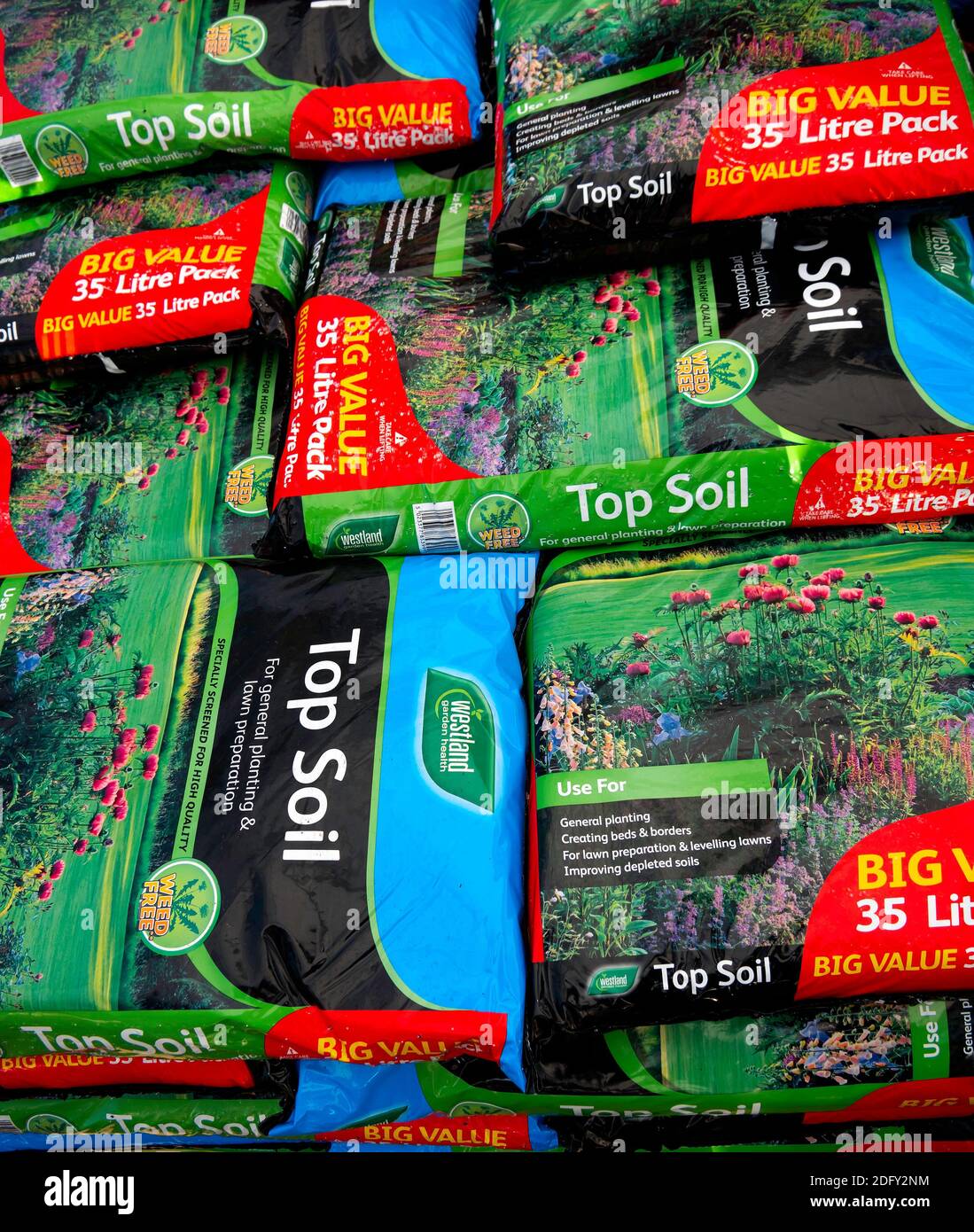 A stack of bags of Westland Top Soil in a garden centre Stock Photo