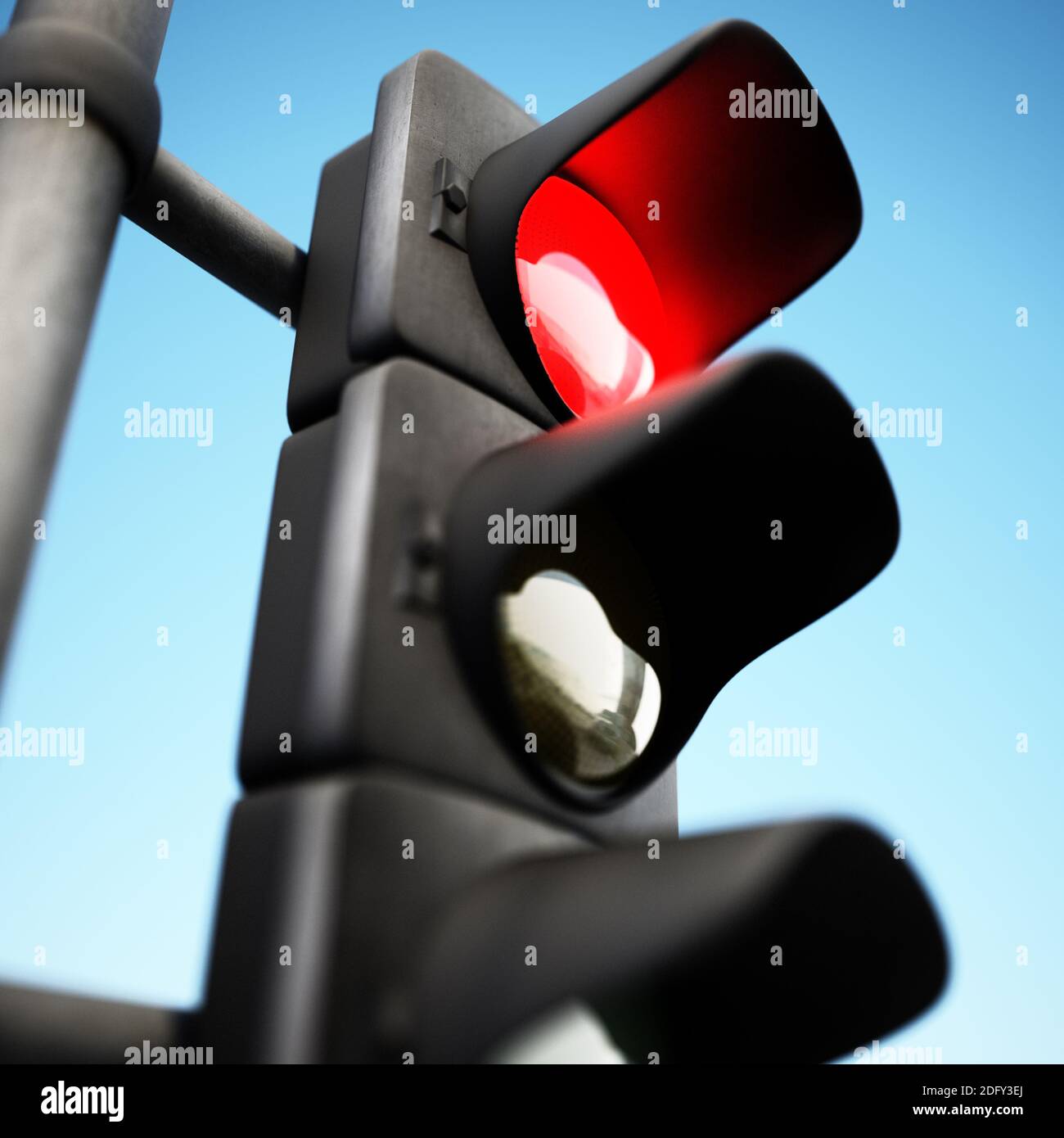 Traffic lamp with red light on against blue background. 3D illustration. Stock Photo