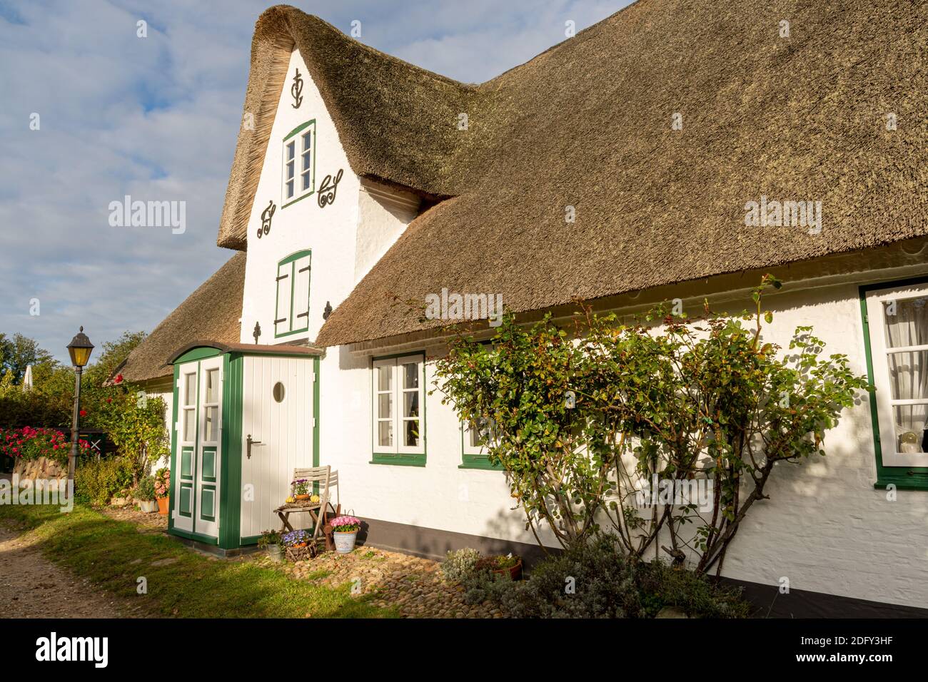 Amrum, Germany - October 17, 2020: White thatched house in Nebel Stock Photo