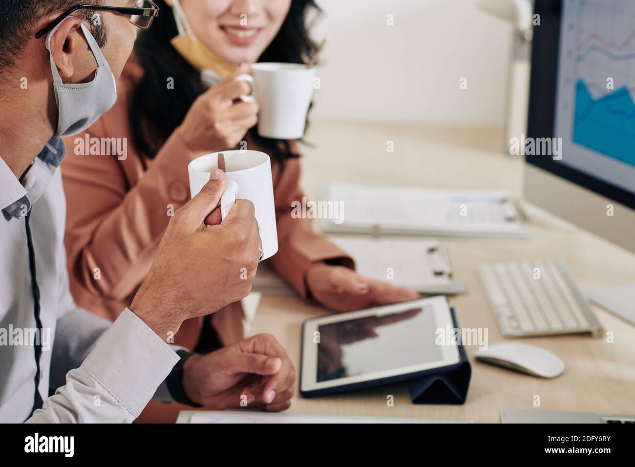 Business colleagues discussing reports Stock Photo