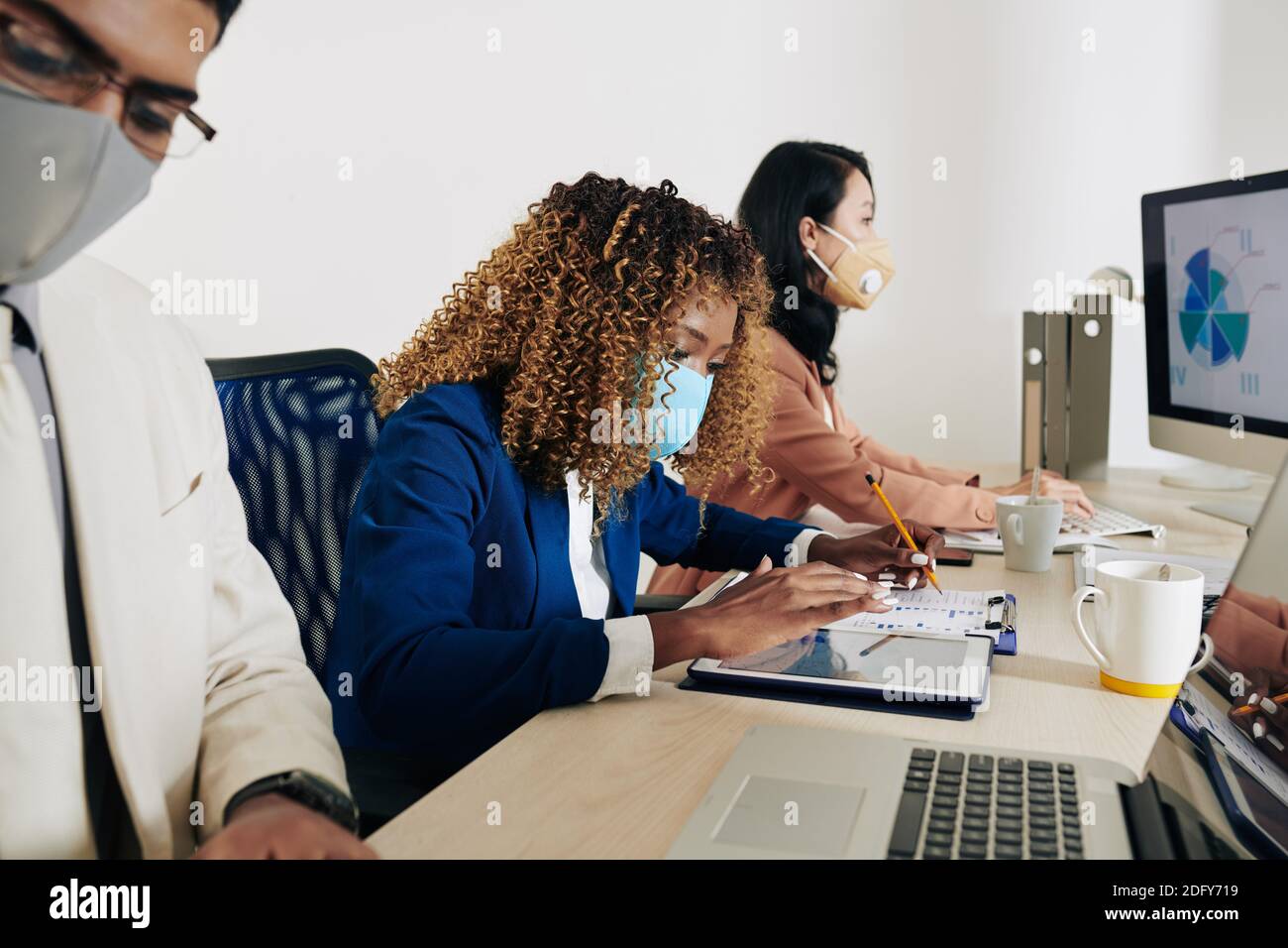 Managers working with reports Stock Photo
